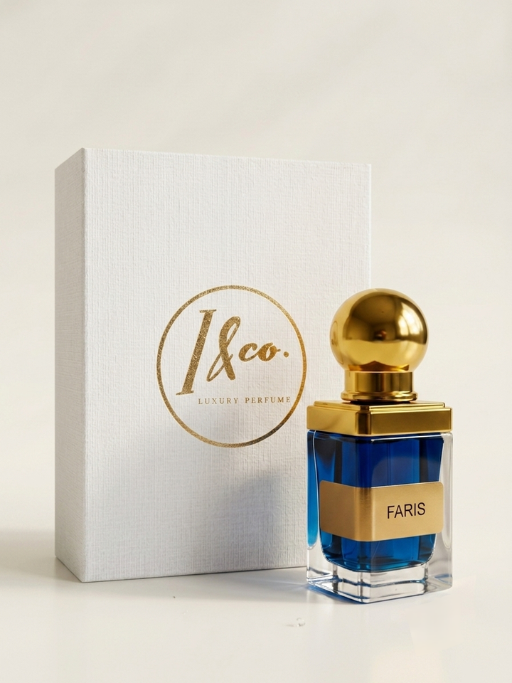 A luxury perfume bottle with a gold cap and blue liquid, standing next to its white textured box with gold '1&co. Luxury Perfumes' branding.