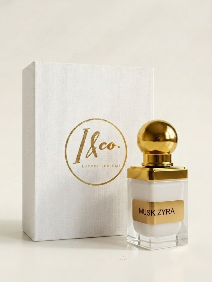 A bottle of Musk Zyra luxury perfume by 1&co. next to its white textured packaging box with gold lettering, set against a clean, light beige background.